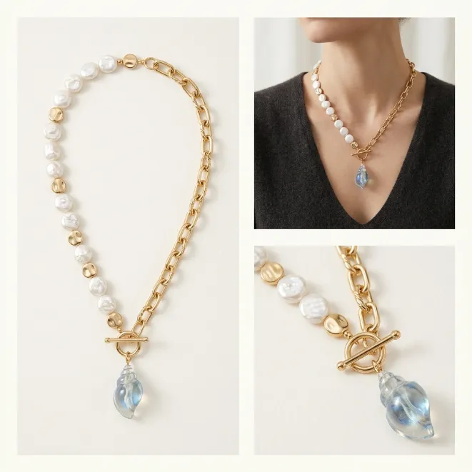 Gold asymmetrical pearl and paperclip chain toggle necklace with clear acrylic conch shell pendant