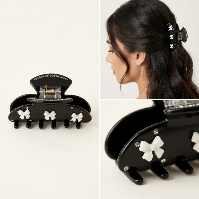 Black hair claw clip with white resin bows and sparkling rhinestones